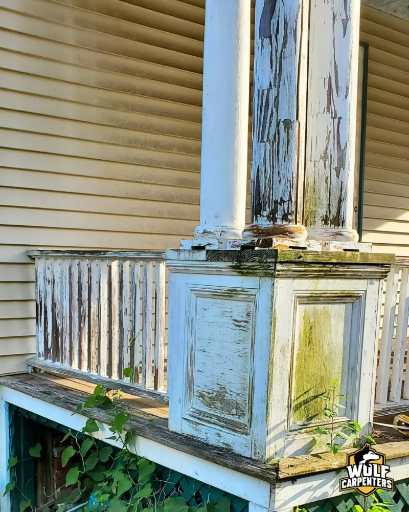 Deteriorated porch railing before renovation
